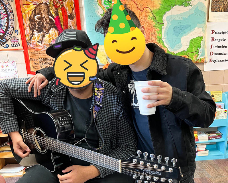 two students with emoji faces