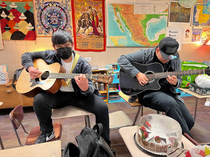 students playing guitars in Spanish classroom